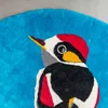 WOODPECKER hand-woven linen rug by Agne Kisonaite