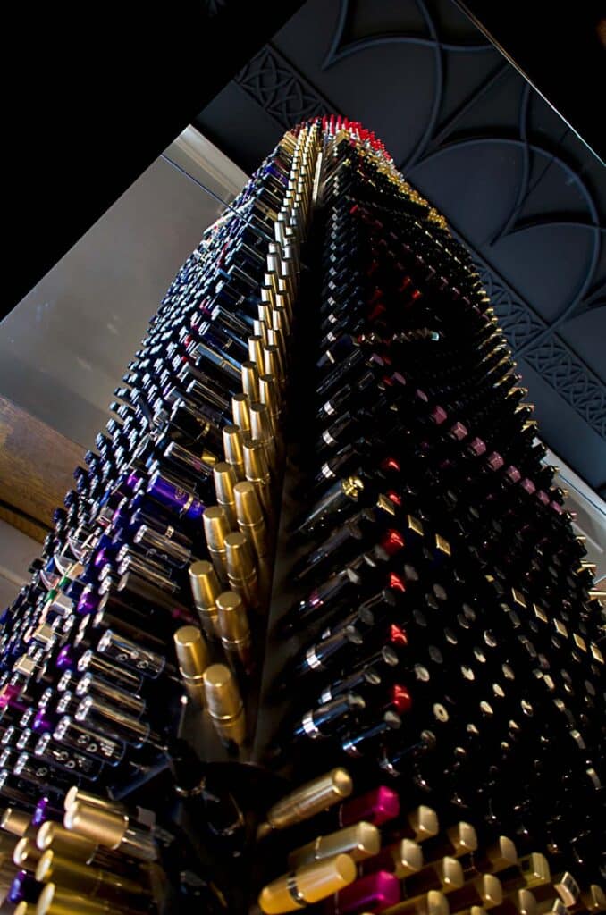 Giant Lipstick installation viewed from below, showing its impressive scale and structure.