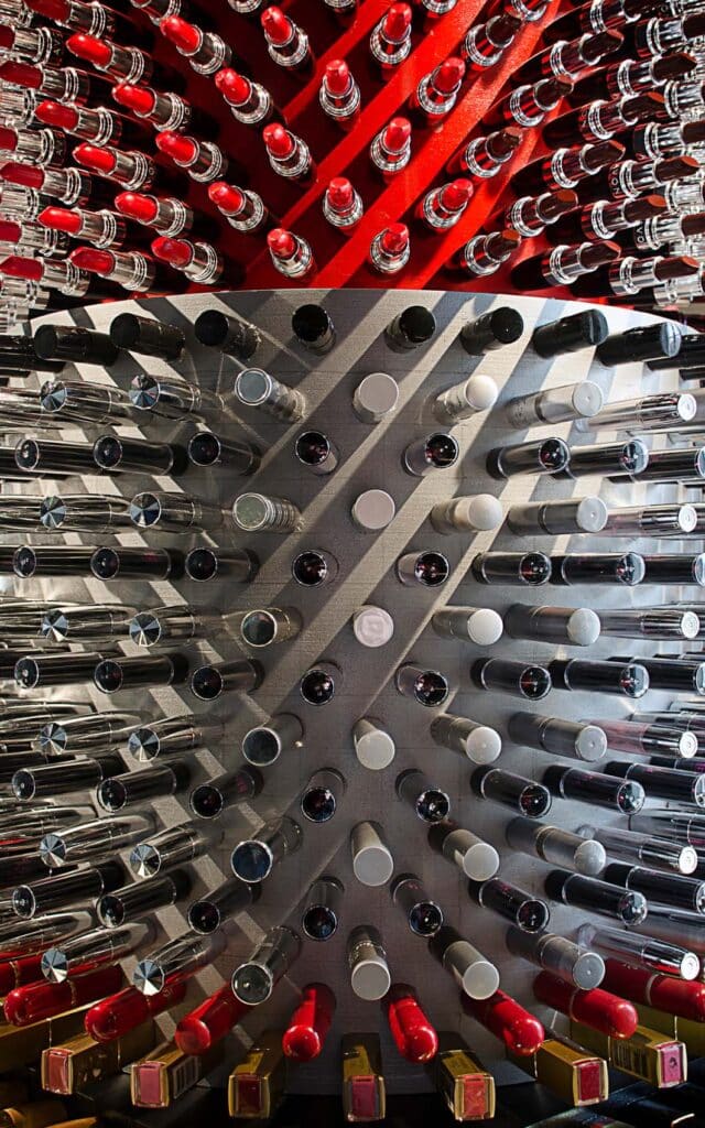 Top view of red and silver lipstick tubes forming the Giant Lipstick waste art installation.
